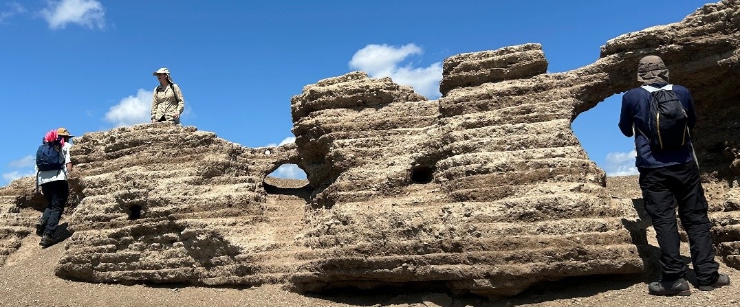 A rock formation with holes in it

AI-generated content may be incorrect.